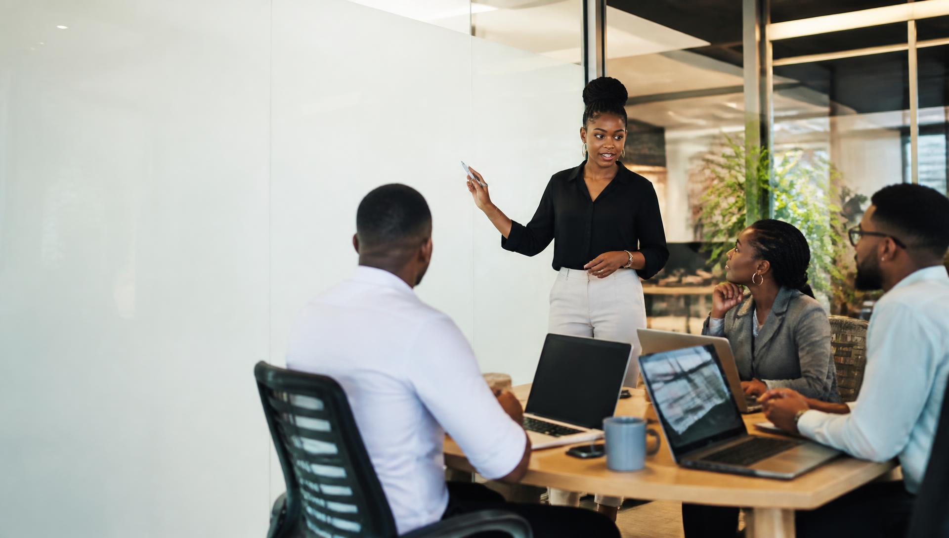 African technology team collaborating in a modern office